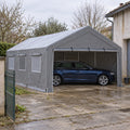 Tente-garage 4 x 6 m grise à fenêtres maille sur dalle ancienne, break bleu nuit abrité